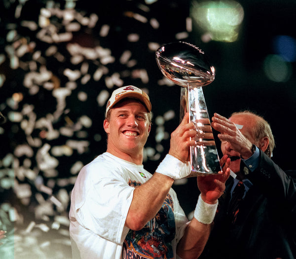 John Elway raises the Vince Lombardi Trophy after his Super Bowl XXXIII win. Craig F. Walker / The Denver Post