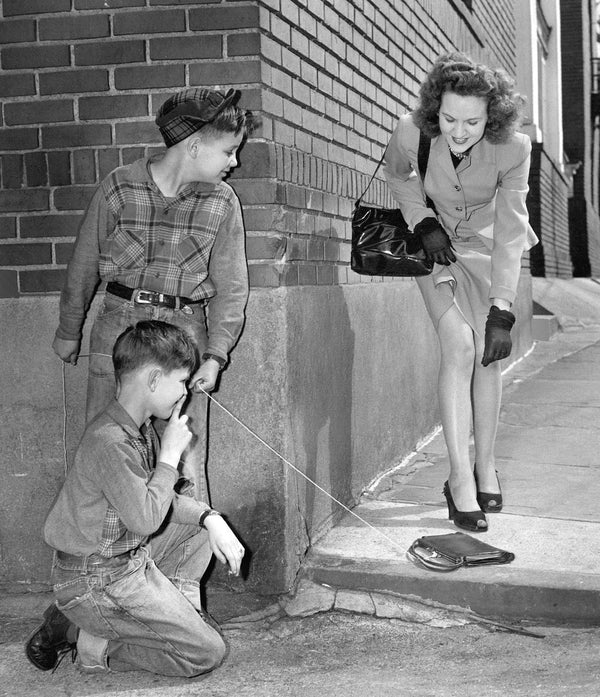 It would seem that Richard Mero (13) and his brother, Luke, (10) (kneeling) have a victim in Mrs. Verda Poppen, on April Fool’s Day in 1947. Courtesy Denver Post via Getty Images, #dpl_1059235.jpg