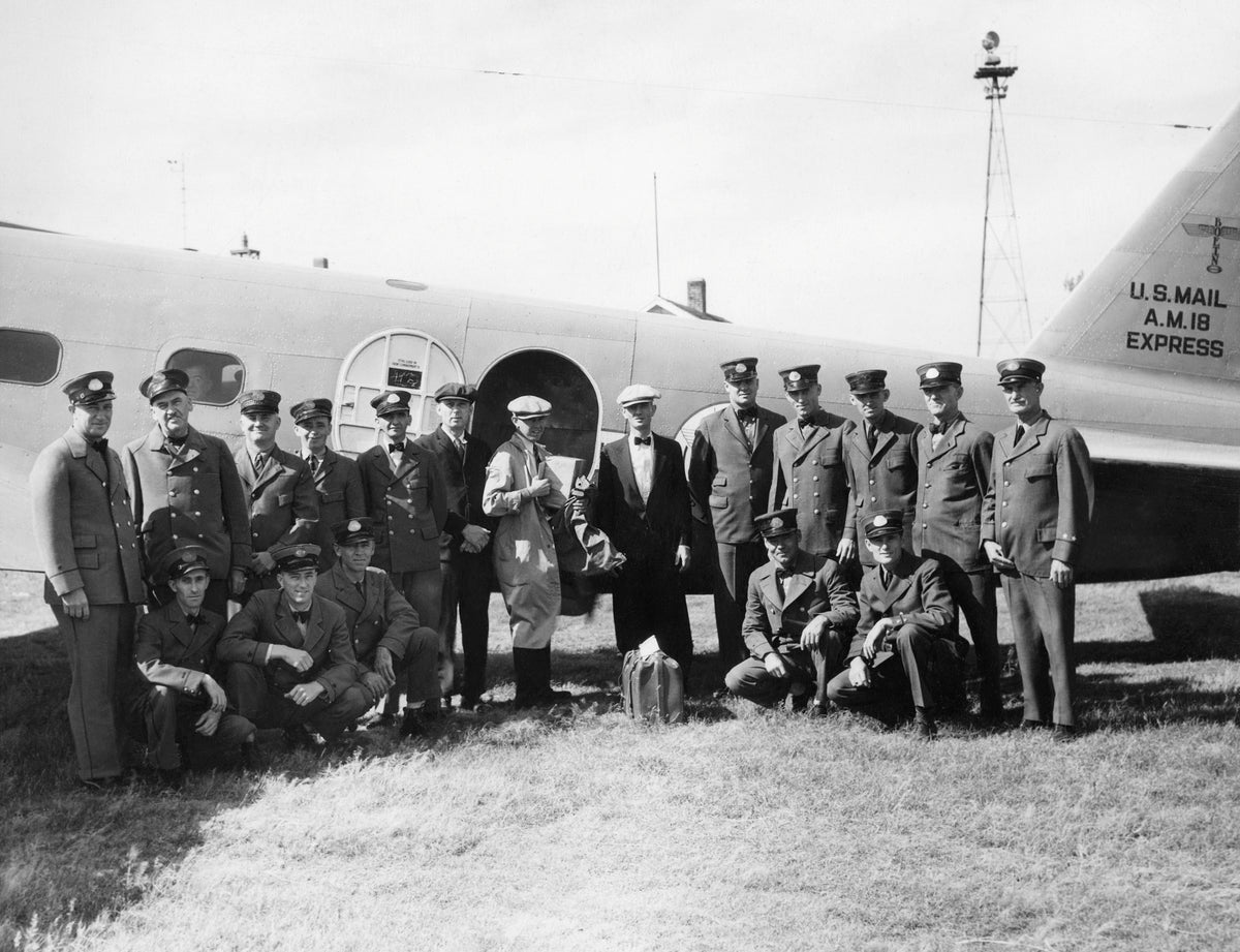 A group of mail carriers by a US Mail A.M. Express Plane, Grand Island Airport, circa 1933. Courtesy Stuhr Museum of the Prairie Pioneer