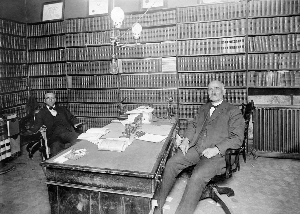 The law office of O. A. Abbot Sr, 208 1/2 West Third Street, Grand Island, circa 1918. O. A. is seated on to the right and Arthur, his son, is seated left. Courtesy Stuhr Museum of the Prairie Pioneer
