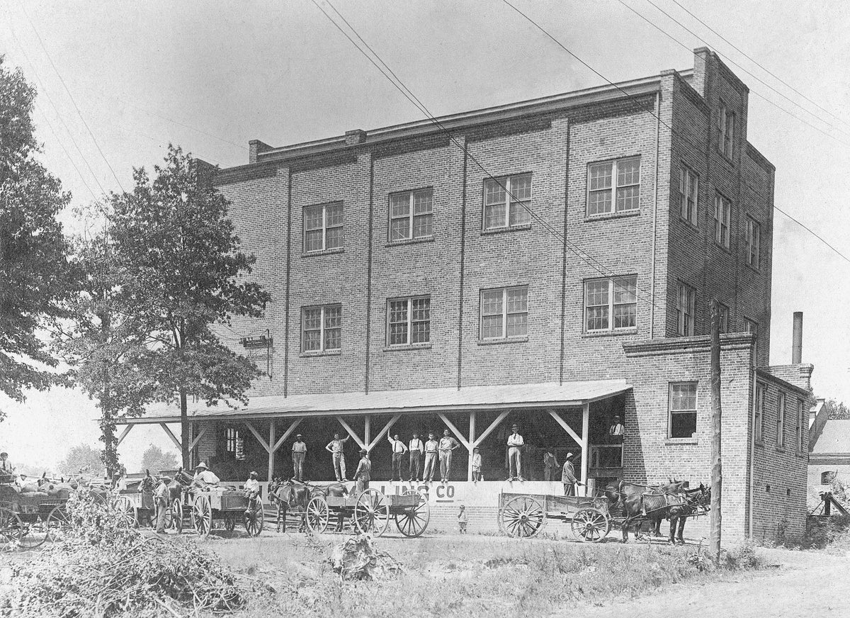 North State Milling Co. at 816 South Elm Street, circa 1915. John Vowell is on the porch, second from left. He worked for the company for roughly thirty years before starting a small grocery store in South Greensboro. Courtesy the King Family
