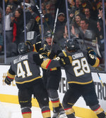 Vegas Golden Knights' Tomas Nosek (92) celebrates with Pierre-Edouard Bellemare (41) and William Carrier (28) after Nosek scored the first goal of the night against the Arizona Coyotes during an NHL hockey game at T-Mobile Arena in Las Vegas on Tuesday, Oct. 10, 2017. Courtesy Chase Stevens/Las Vegas Review-Journal