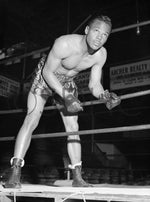 Boxer Titus Hawkins, 22, at the Coliseum boxing ring in downtown San Diego, 1945. The San Antonio middle-weight fought numerous times locally. In 61 bouts and 288 rounds, he delivered knockouts 34 percent of the time. CourtesySan Diego History Center, Union-Tribune Collection (#UT 16044-3)