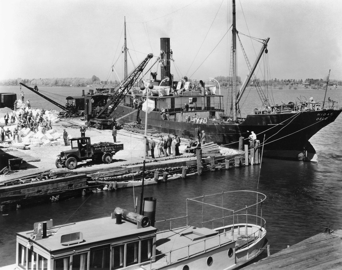 The Norwegian ship Nidar from Oslo unloading wood pulp at the Harrington Coal dock at the west end of Eighth Street, Holland, 1928. Courtesy The Harrington Collection