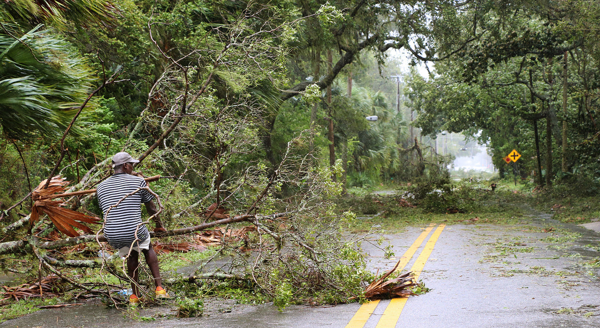 Lamont Stalling sits in disbelief as he takes in the damage around his Holly Hill neighborhood. News-Journal/Jim Tiller