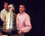In August 1997, students at Cabrini were told to gather for an assembly about new drunken driving laws but instead were treated to a visit by the Stanley Cup. Bill L. Roose and Mick McCabe covered the event — and held the coveted chalice. DAVID P. GILKEY/DETROIT FREE PRESS