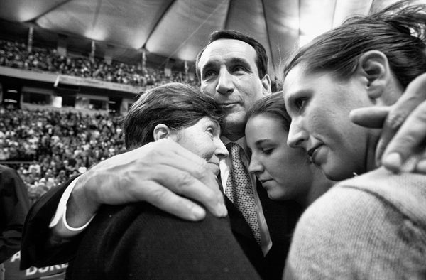Mike Krzyzewski gets a family hug from wife Mickie (left) and daughters Jamie (middle) and Lindy (right) after the Blue Devils' NCAA championship win, April 2, 2001, in the Metrodome. Chuck Liddy/The News & Observer