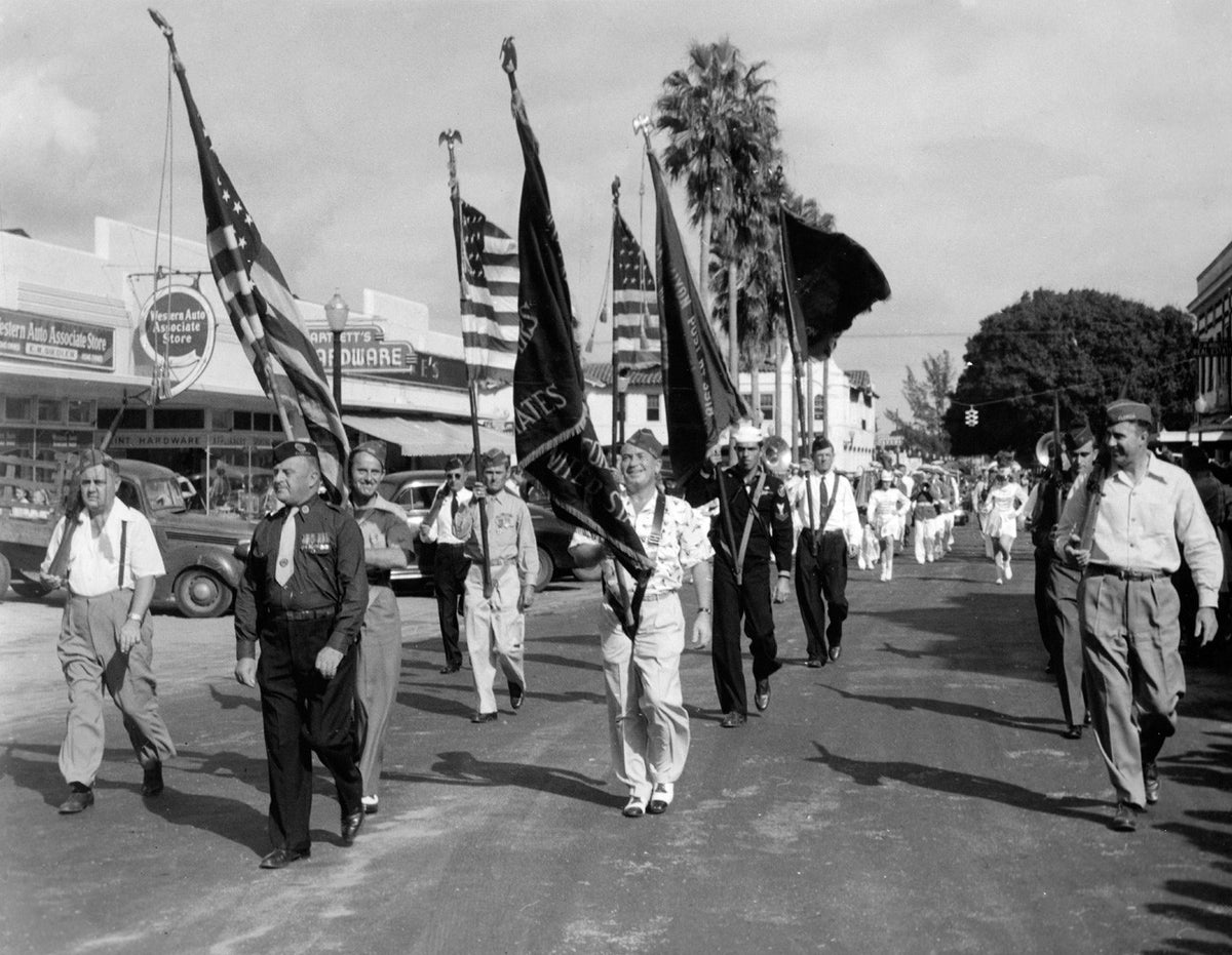 Alex MacWilliam, a WWI veteran, leads the 1941 Armistice Day Parade through Vero Beach. The Vero Beach High School Band follows behind. Courtesy Indian River County Historical Society Collection, Archive Center, Indian River County Main Library