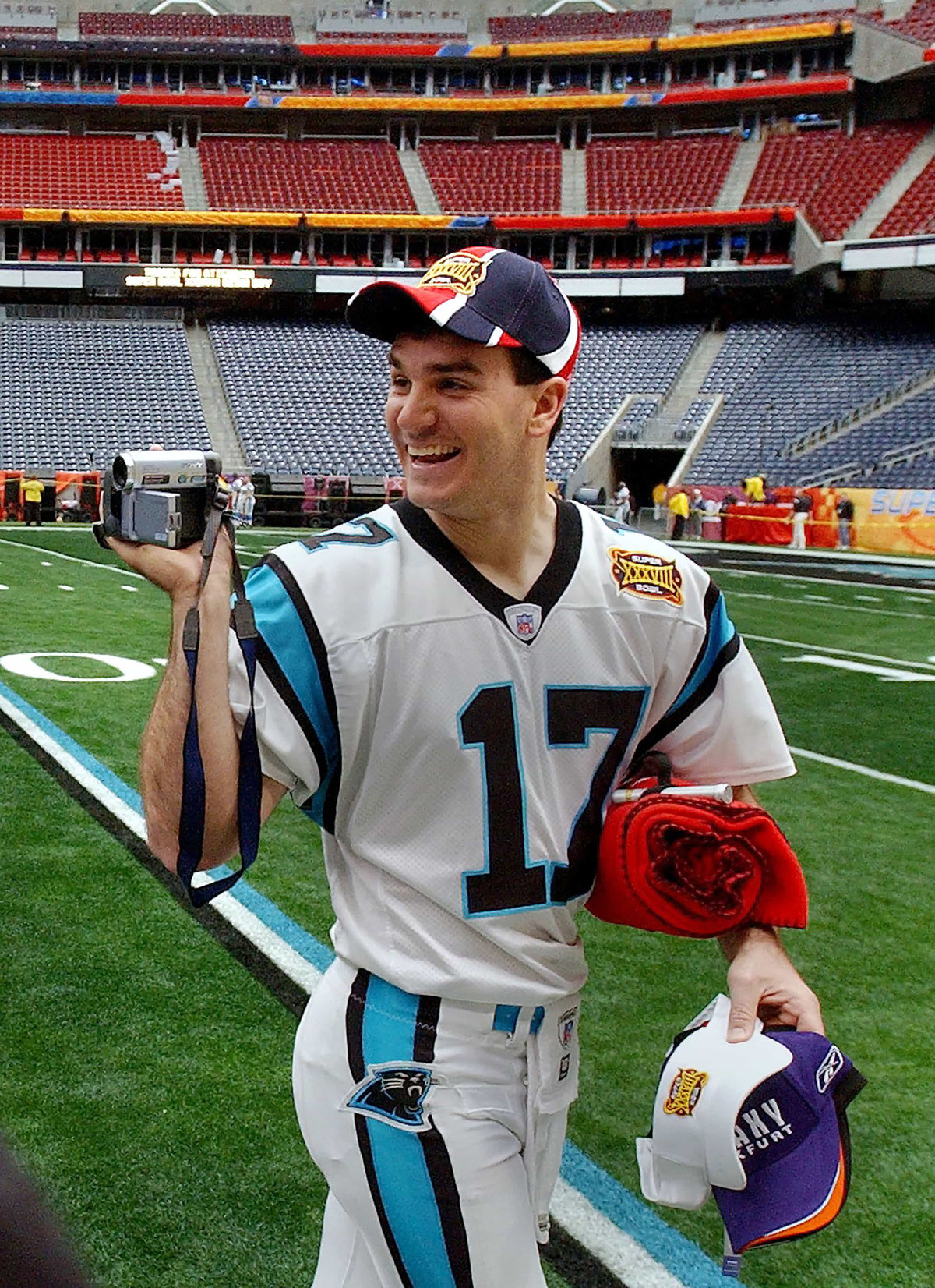 Jake Delhomme videotapes the Super Bowl media day activities at Reliant Stadium in Houston on Jan. 27, 2004. JEFF SINER / THE CHARLOTTE OBSERVER