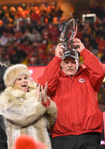 Tammy Reid looked on as Chiefs head coach Andy Reid hoisted the Lamar Hunt Trophy as the team celebrated after defeating the Cincinnati Bengals,  23-20, in the AFC Championship Game on Sunday, Jan. 29, 2023, at GEHA Field at Arrowhead Stadium. (Tammy Ljungblad/The Kansas City Star)