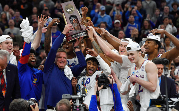 Coach Bill Self and the Kansas Jayhawks hoist the NCAA Midwest Regional Championship trophy after defeating Miami, 76-50, at the United Center in Chicago. Rich Sugg / The Kansas City Star