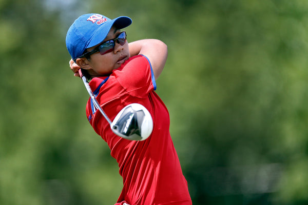 Yupaporn Kawinpokorn watched the flight of a drive during the 2014 NCAA Women’s Golf Championship at the Tulsa Country Club.