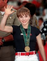 Gymnast Kerri Strug waves to the crowd at Hi Corbett field during a home-coming ceremony held in honor of returning Tucson Olympians. Courtesy Sarah Prall / Arizona Daily Star