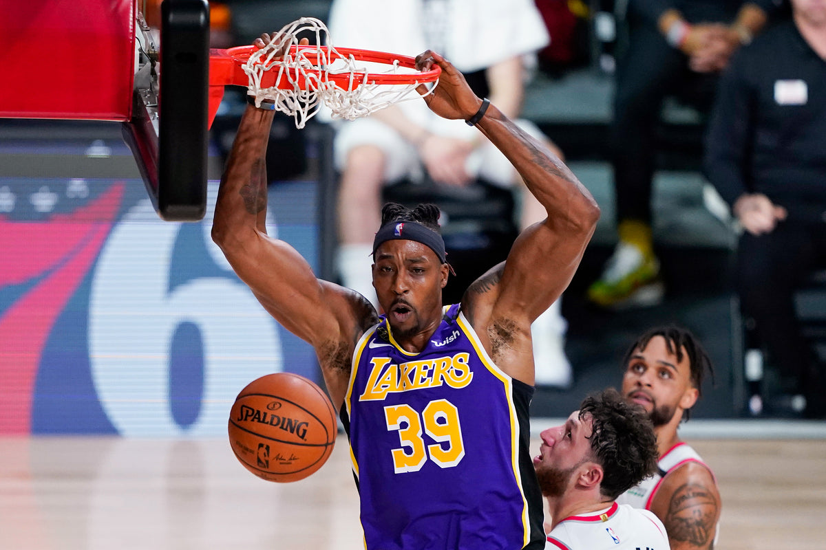Dwight Howard makes this slam count against the Portland Trail Blazers. It’s clearly a low-risk shot, accounting for a field goal percentage of 68 during the playoffs. Ashley Landis / Associated Press