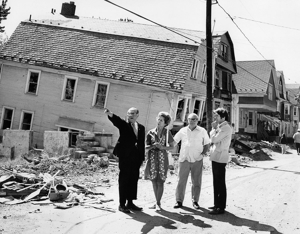 A collapsed house and empty foundation, probably in Wilkes-Barre. Luzerne County Historical Society