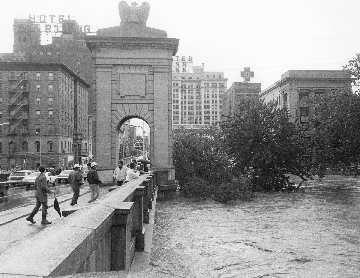 Bystanders watch the rising river from the Market Street Bridge in downtown Wilkes-Barre. Luzerne County Historical Society