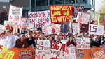Alabama and LSU fans wave signs and cheer during ESPN's College Gameday show in front of Bryant-Denny Stadium prior to the game. The crowd on campus was to be one of the largest ever.