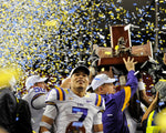 Tyrann Mathieu basks in the confetti-filled atmosphere as coach Les Miles and other LSU players hoist the trophy after the Tigers routed Georgia 42-10 in the SEC Championship Game in Atlanta on Dec. 3, 2011. Mathieu was named the game’s MVP. Travis Spradling / The Advocate