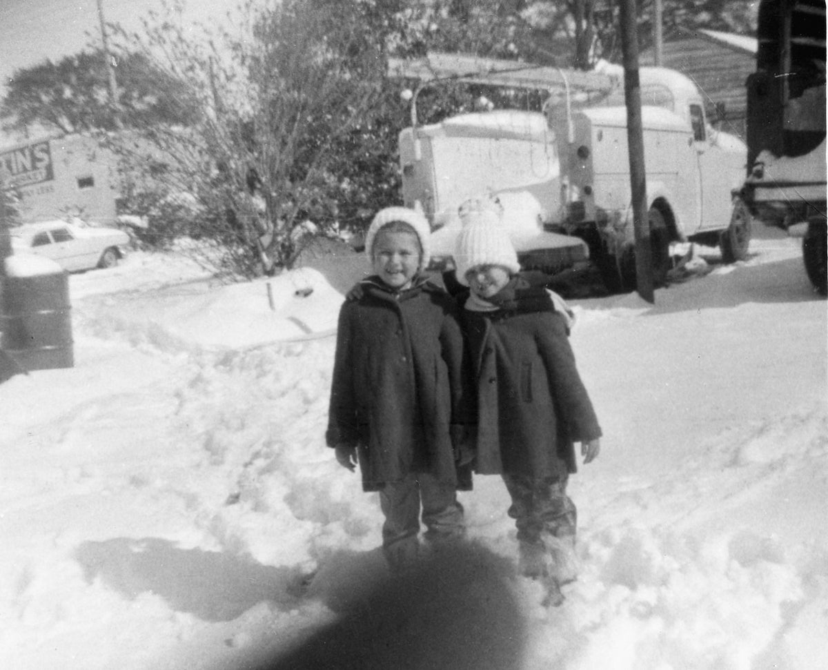 Lana Hughes Myers, left and Libby Hughes Keene near their home at North 14th Avenue, circa 1962.