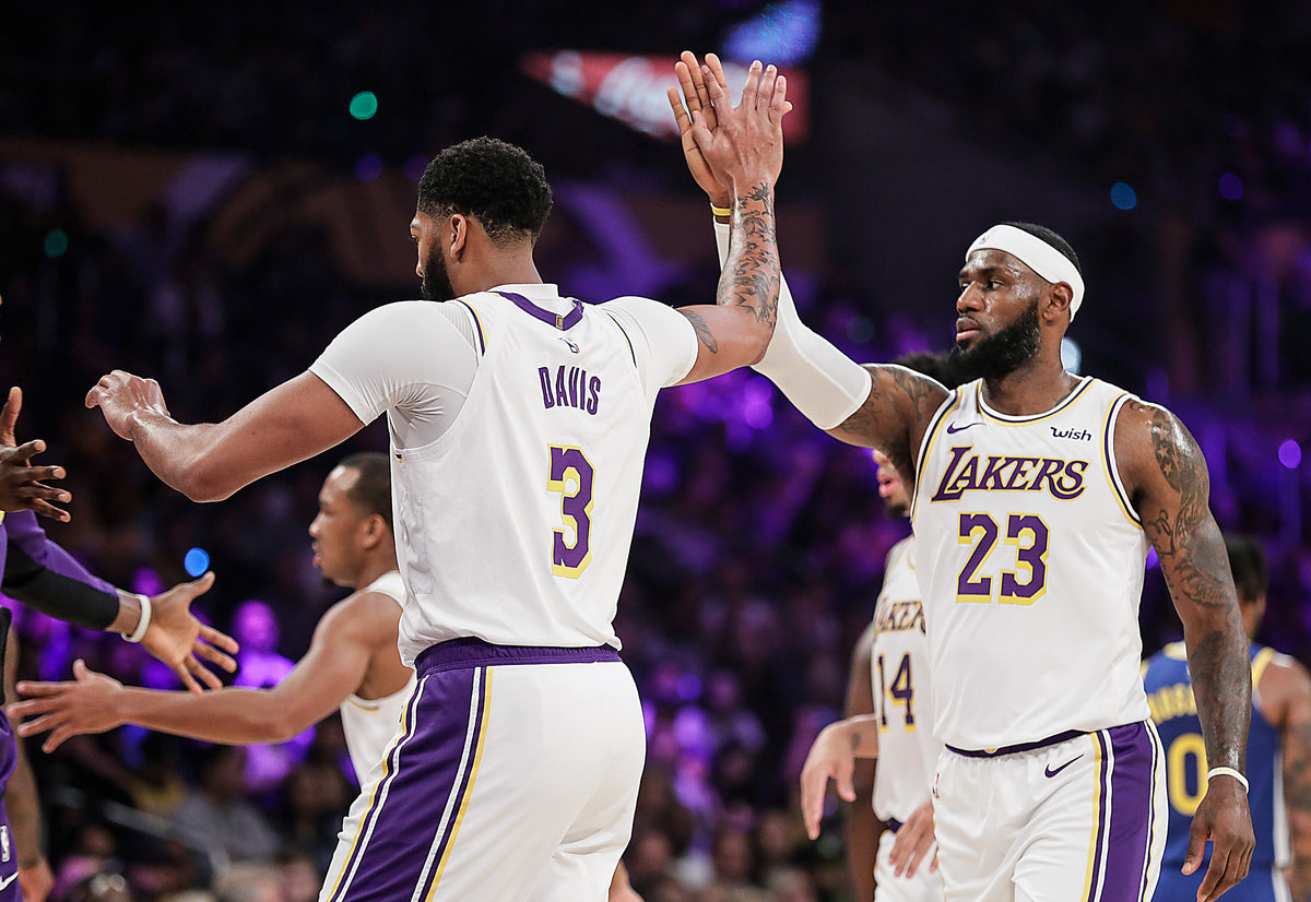  It didn’t take long before the Lakers two marquee players — Anthony Davis, left, and LeBron James — learned to mesh their games leading to the frequent and inevitable high five. Robert Gauthier / Los Angeles Times