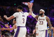  It didn’t take long before the Lakers two marquee players — Anthony Davis, left, and LeBron James — learned to mesh their games leading to the frequent and inevitable high five. Robert Gauthier / Los Angeles Times