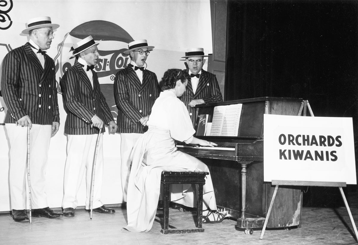 Orchards Kiwanis Barbershop Quartet, 1955. Left to right are O.B. Larsen, John King, Robert Harris, Bob Willett, and Mrs. Douglas Sinclair at the piano. Courtesy Nancy Sinclair Longfellow