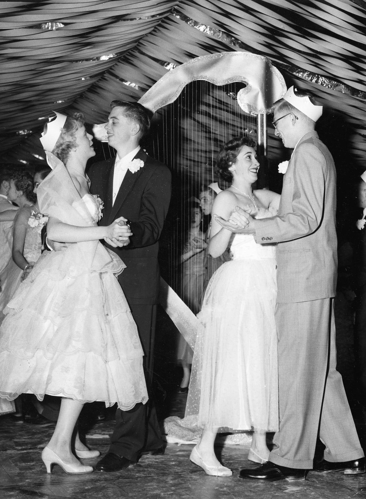 The Lewiston High School prom in the school's gymnasium, December 5, 1954. Left to right: sophomore Sonya Hoene, 15, seniors John Rosholt, Anita King and Dale Williams, all 17. Courtesy Lewiston Morning Tribune
