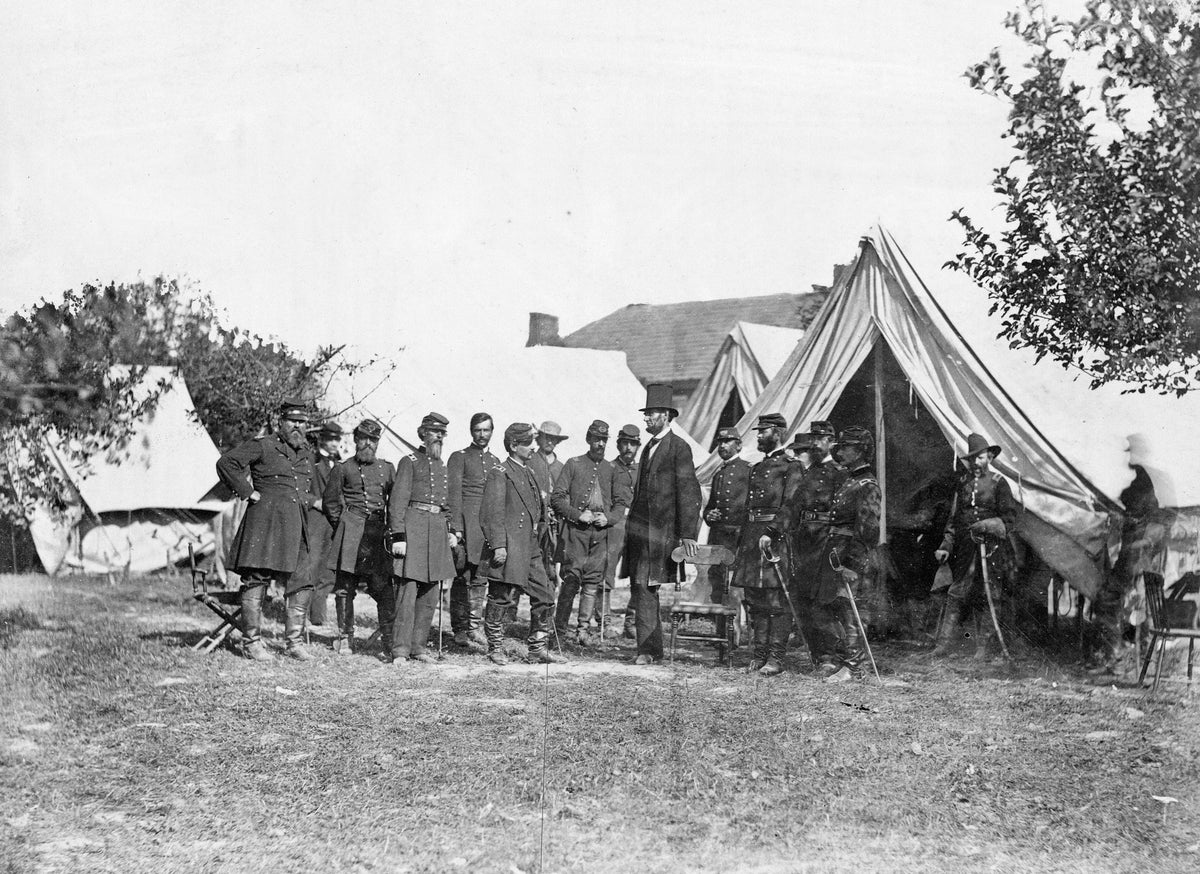 President Lincoln with Gen. George B. McClellan and group of officers following the Battle of Antietam, in 1862. Included in the photo, from left, are: Col. Delos B. Sacket, Capt. George Monteith, Lt. Col. Nelson B. Sweitzer, Gen. George W. Morell, Col. Alexander S. Webb, Gen. George B. McClellan, Scout Adams, Army Medical Director Dr. Jonathan Letterman, Unknown, President Lincoln, Gen. Henry J. Hunt, Gen. Fitz-John Porter, Unknown, Col. Frederick T. Locke, Gen. Andrew A. Humphreys, Capt. George Armstrong