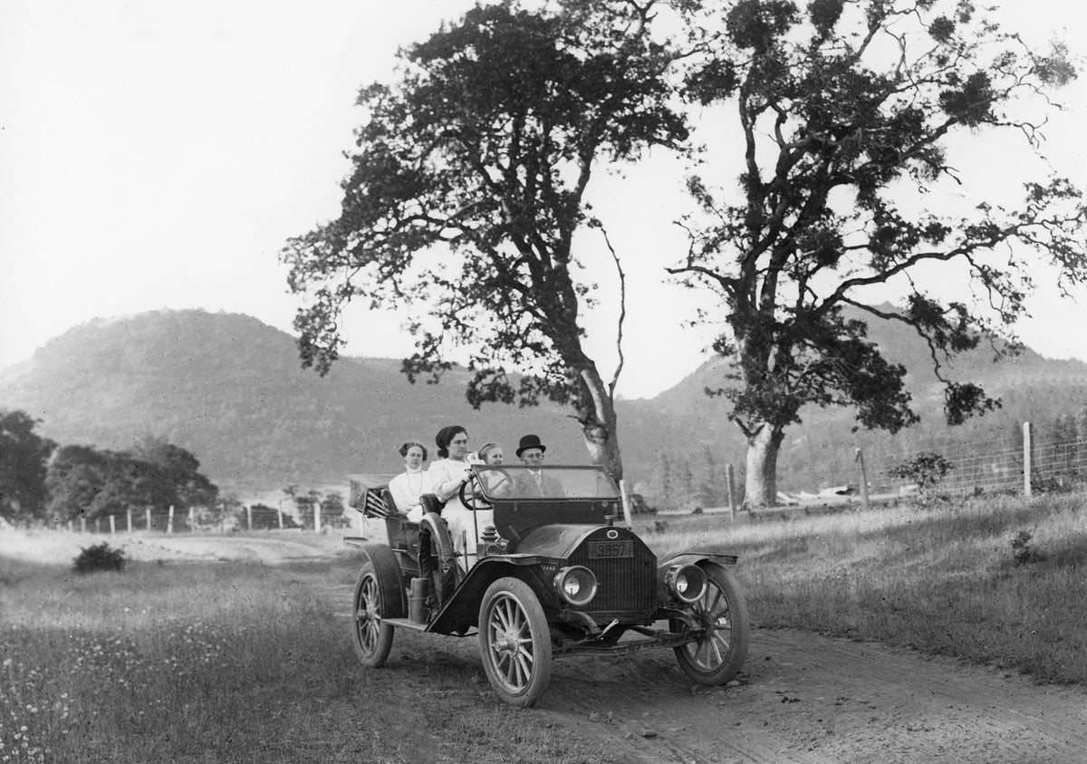 A family enjoying a drive in their Regal automobile, circa 1915. Included, from left: Mabel Lacey, Elizabeth Lacey Love, unidentified, George Lacey. Courtesy Linn County Historical Museum