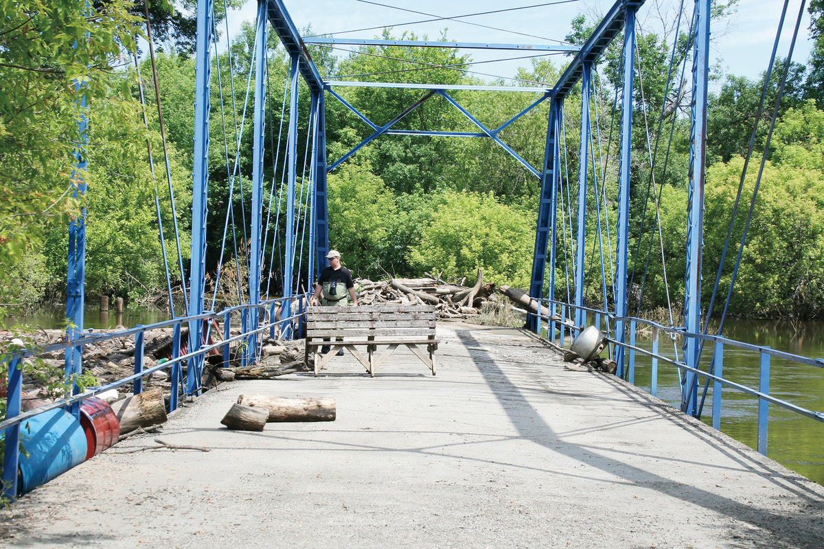 Any bridge along the swollen Souris River found itself swamped with debris, including this structure near Logan.