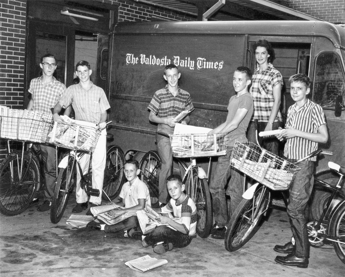 Valdosta Daily Times carriers pose for newspaper promotion picture at the circulation department loading dock in 1964. Seated are the Lefiles brothers. The only other boy identified is Harley Winter, standing, second from left. Robert Cosby Winter III