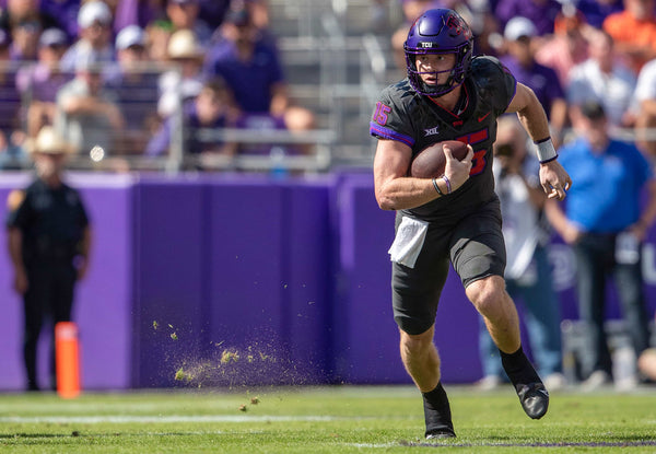 TCU quarterback Max Duggan runs the ball in their game against OSU at the Amon G. Carter Stadium in Fort Worth on Oct. 15, 2022. (Madeleine Cook / Fort Worth Star-Telegram)
