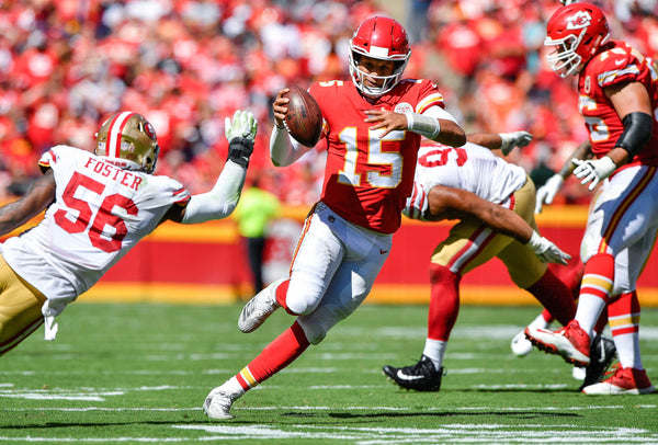 A nimble-footed Mahomes scrambles around the San Francisco 49ers’ defense in the second quarter of a sunny September 2018 showdown at Arrowhead.  Kansas City Star