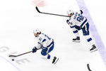 The Tampa Bay Lightning’s Nikita Kucherov (86) and Brayden Point (21) skate during first-period action against the New York Islanders in Game 4 of the Eastern Conference final on Sept. 13, 2020, in Edmonton. Special to the Times / Mario Ditkun