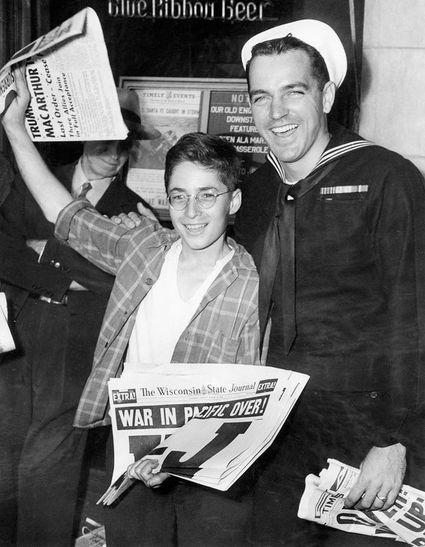 Wisconsin State Journal newsboy Bernard Ehrman celebrating Victory Over Japan Day with Seaman Tom Teeley, who was passing through Madison after 17 months in the Pacific, August 14, 1945. Courtesy Wisconsin State Journal