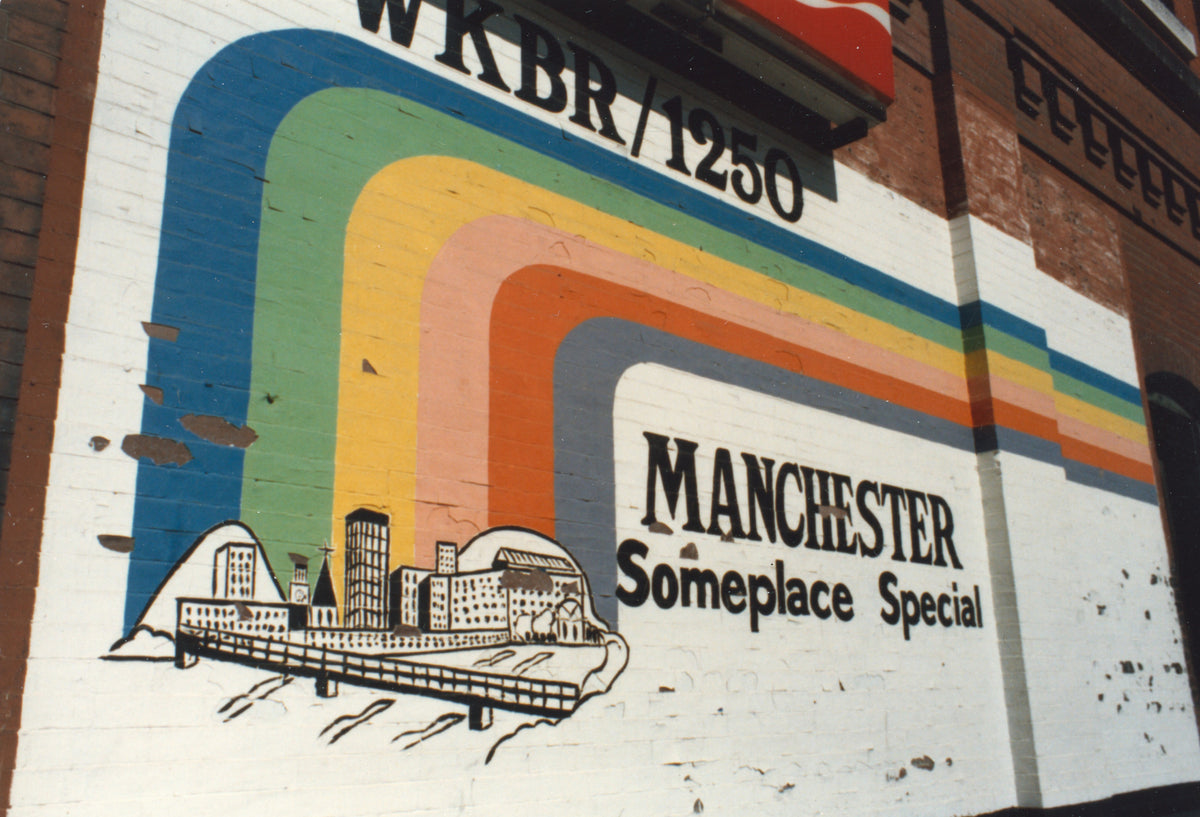 Painted mural advertising WKBR/1250 Radio station on the Chandler Building at the corner of Bridge and Elm Streets, 1982. Courtesy David Laliberté