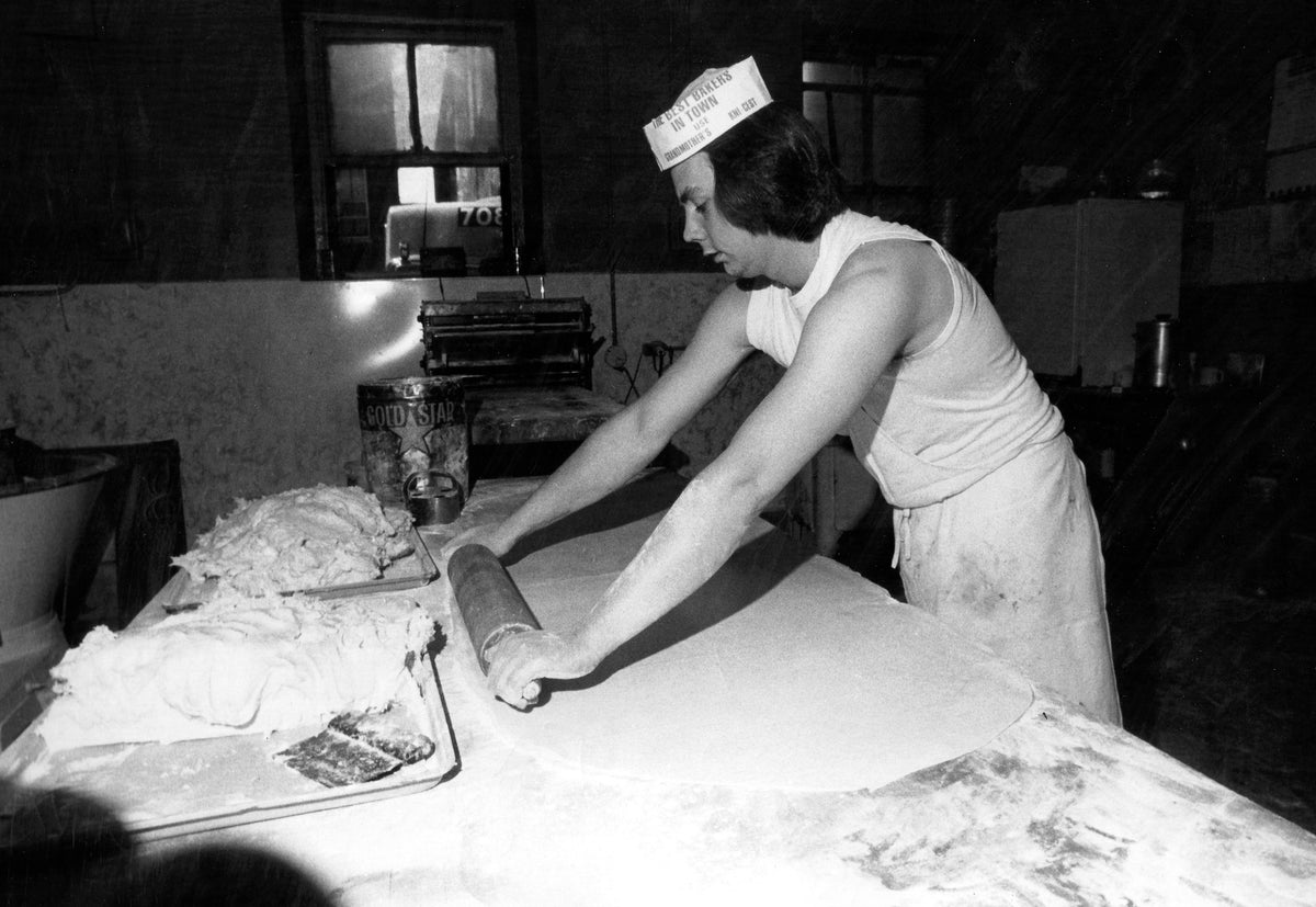 A worker at T.T.K. Bakery on Chestnut Street rolls dough in 1978. Courtesy Union Leader Archives