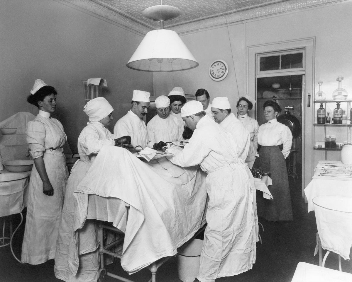 Doctors and nurses treating a patient, circa 1908. COURTESY BASSETT HISTORICAL CENTER