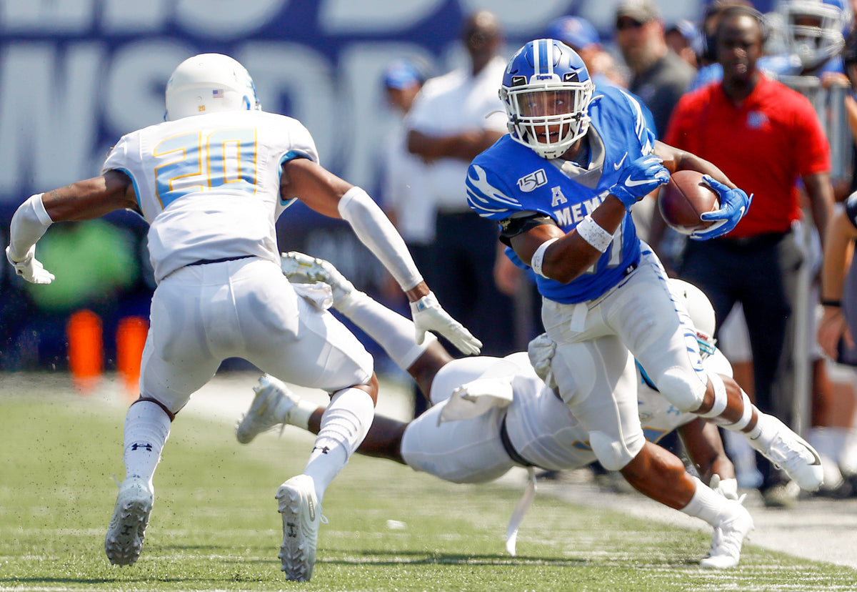 Memphis running back Timothy Taylor tries to juke past Southern cornerback Datrel Brumfield. Courtesy Joe Rondone / The Commercial Appeal