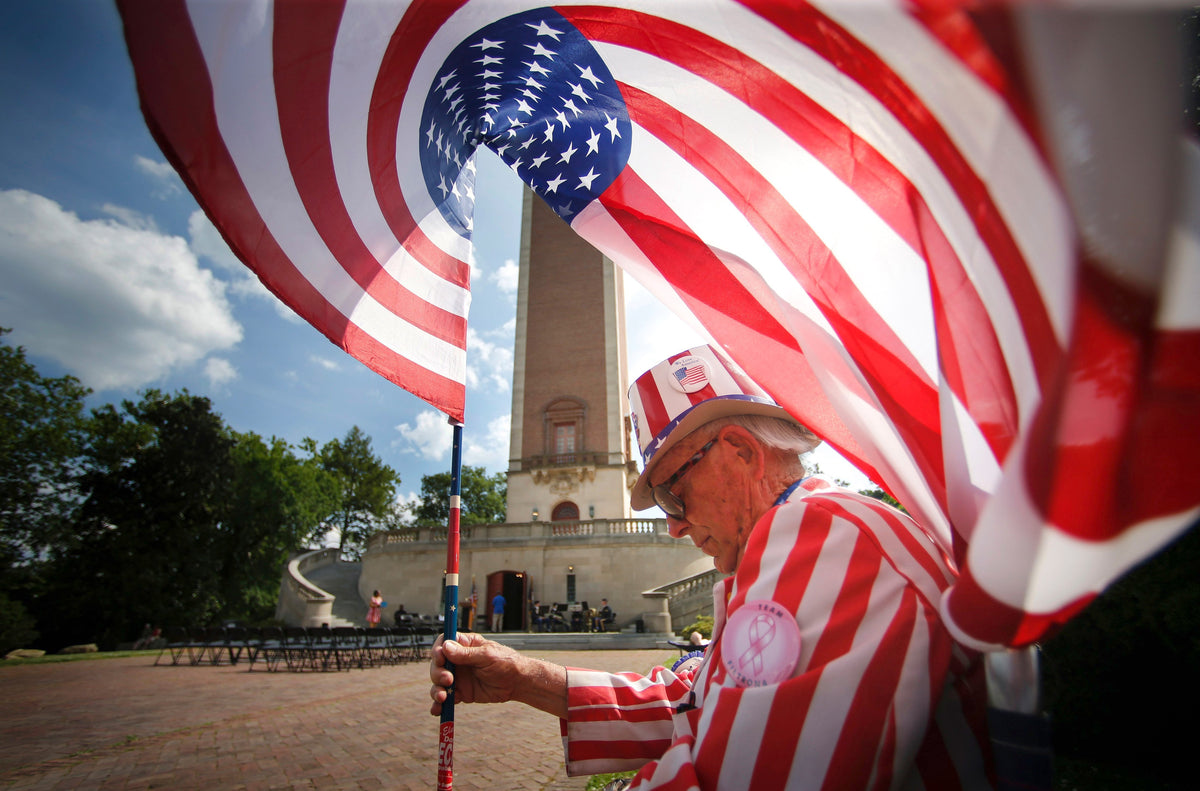 Tommy Sammons of Richmond waiting for a military band concert to begin at the Carillon, a memorial dedicated to Americans who died in WWI in Richmond, May 26, 2014. Sammons, a US Navy veteran, is a fixture at patriotic festivities in Richmond, typically dressing as Uncle Sam and carrying a flag. Courtesy Richmond Times-Dispatch