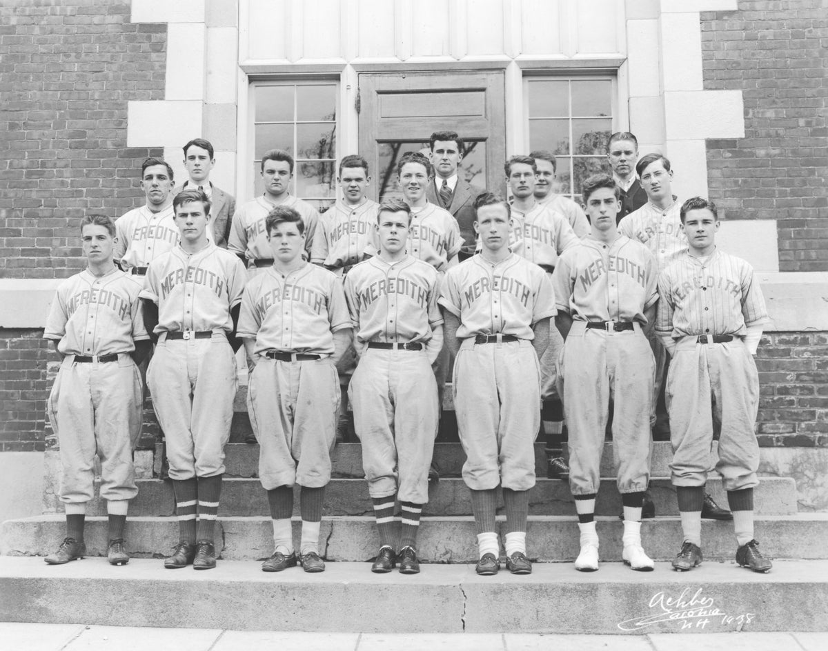 Meredith High School baseball team, 1938. Front row: George Sanborn, Paul Ambrose, Gordon Brown, Philip Blackey, Harold Martin, Leroy Moulton, Allen Ford. Second row: Joe Marden, Frances Hughes, Merton Wheeler, Shirley Humiston, Fred Silcox, Stewart Lamprey. Back row: Richard Parrott, Coach Toll, Perley Valliere, Everett Bodge. Meredith Historical Society.