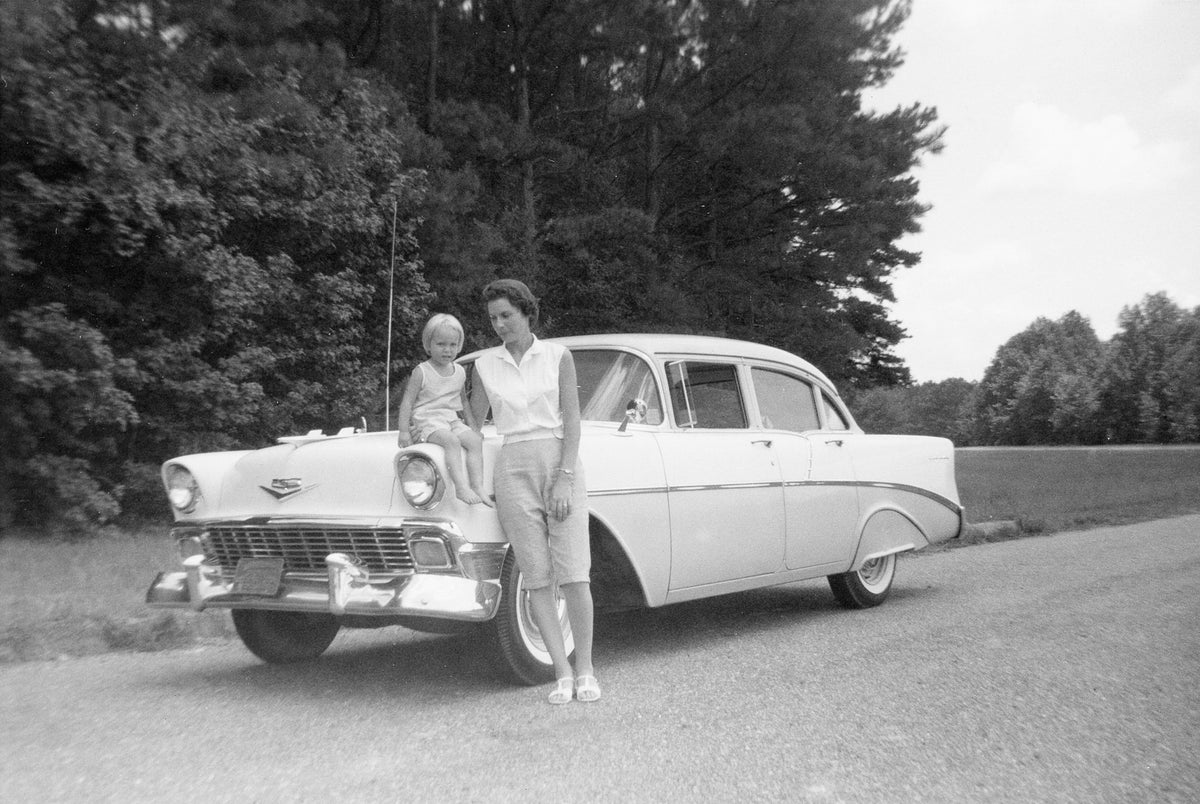 Janelle Alexander and her daughter, Debra Kay on their 1956 Chevrolet in 1961. The Chevy cost $2,600 new.