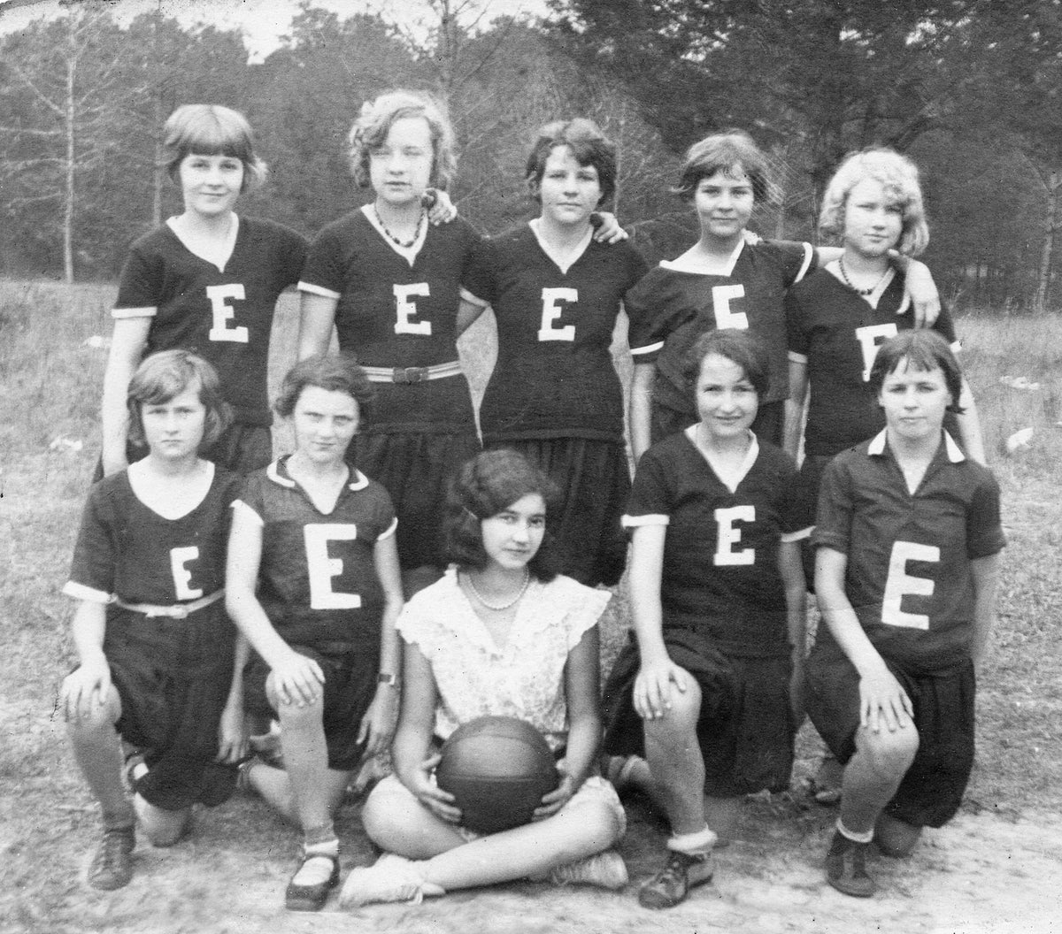 Enterprise School Girl's Basketball Team, 1933. In front, from left is Christine Baskett, Quinelle Bryant, Doris Davis, and Eloise Moulds. In back, from left is Celeste Moore, Margaret Lee, Melanie Reuter, Mellie Boyd, Franie Bell Baskett. Coach was Sybil Baskett.