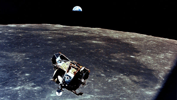 With a half-Earth in the background, the Lunar Module with moon-walking astronauts Neil Armstrong and Buzz Aldrin approaches for a rendezvous with the Apollo Command Module, manned by Michael Collins. The Apollo 11 liftoff from the moon came early, ending a 22-hour stay by Armstrong and Aldrin. CourtesyNASA