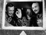 Apollo 11 astronauts presented this picture when they arrived aboard their mobile quarantine facility at Ellington AFB. Neil Armstrong gives the A-OK sign. Buzz Aldrin hams it up for friends and Michael Collins just grins. CourtesyNASA