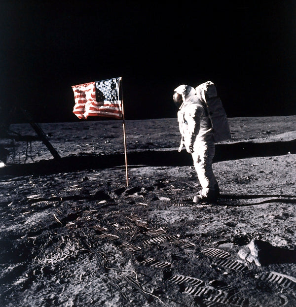 Buzz Aldrin poses beside the U.S. flag planted on the moon during the Apollo 11 mission. CourtesyNASA