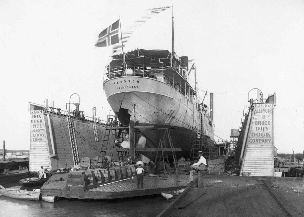 The "Taunton" at Ollinger and Bruce Dry Dock, circa 1910. The boy at the center of the photo is Harry Leo Ollinger. His grandfather William Ollinger is at right.