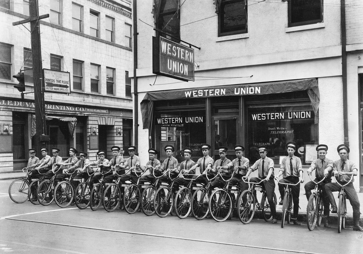 Western Union delivery boys in front of the office at 64 North Royal (at St. Michael), Mobile, circa 1925.