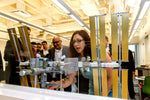 Dr. Dorit Donoviel in front of a model of the International Space Station. CourtesyLeroy Gibbins