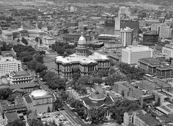 Colorado Capitol building as seen from a helicopter, June 17, 1959. From The Denver Post archives, “Colorado’s historic gold-domed Statehouse, once a conspicuous structure on Denver’s Capitol Hill, is losing its commanding position yearly in the face of progress. This helicopter photo was taken toward the northwest.” COURTESY THE DENVER POST VIA GETTY IMAGES, DAVE MATHIAS, #DPL_1223982